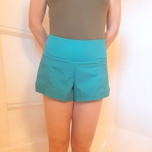 Womens running shorts by Constantly Varied Gear (CVG), Turquois, Size small